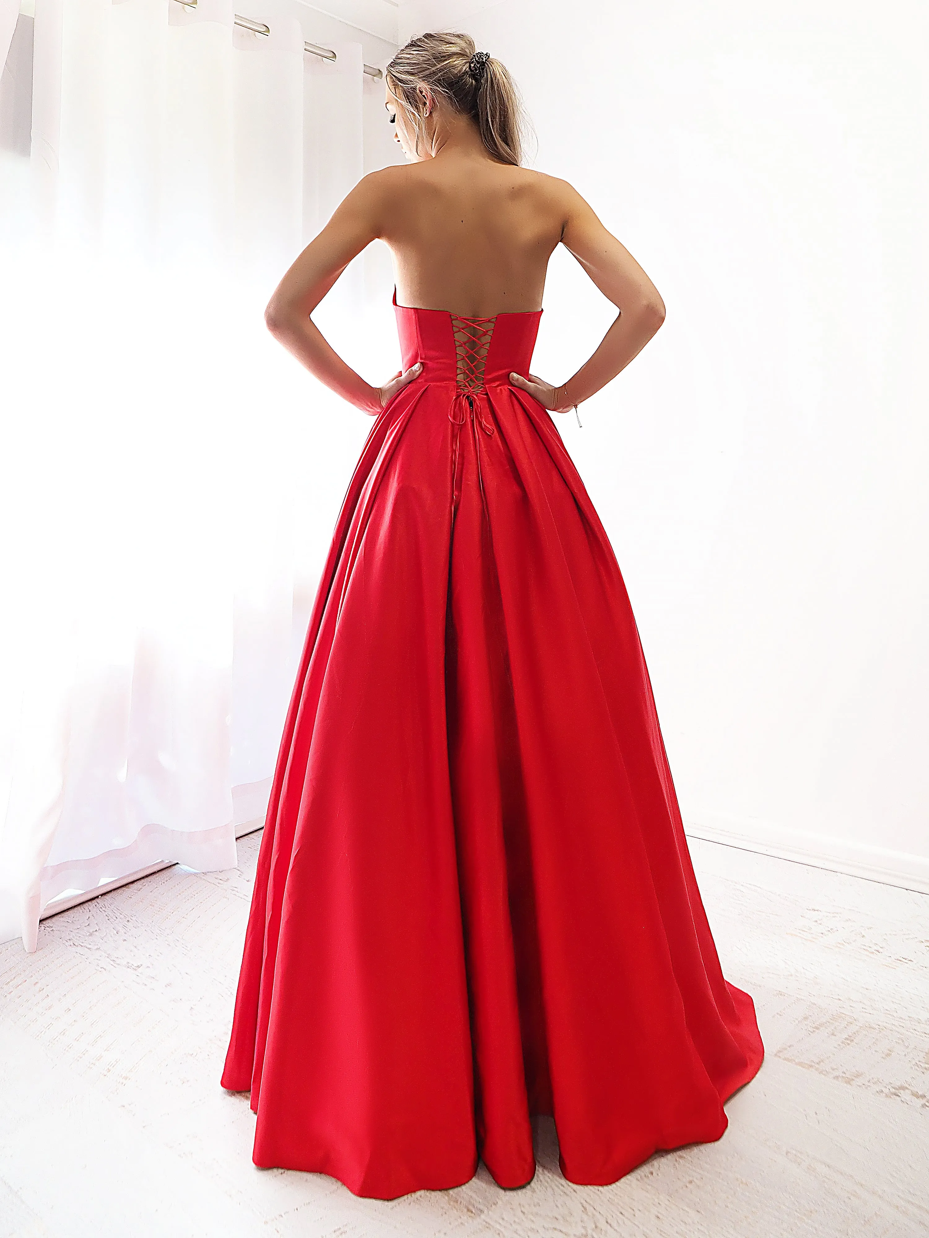 Bright red satin princess dress with crescent moon neckline