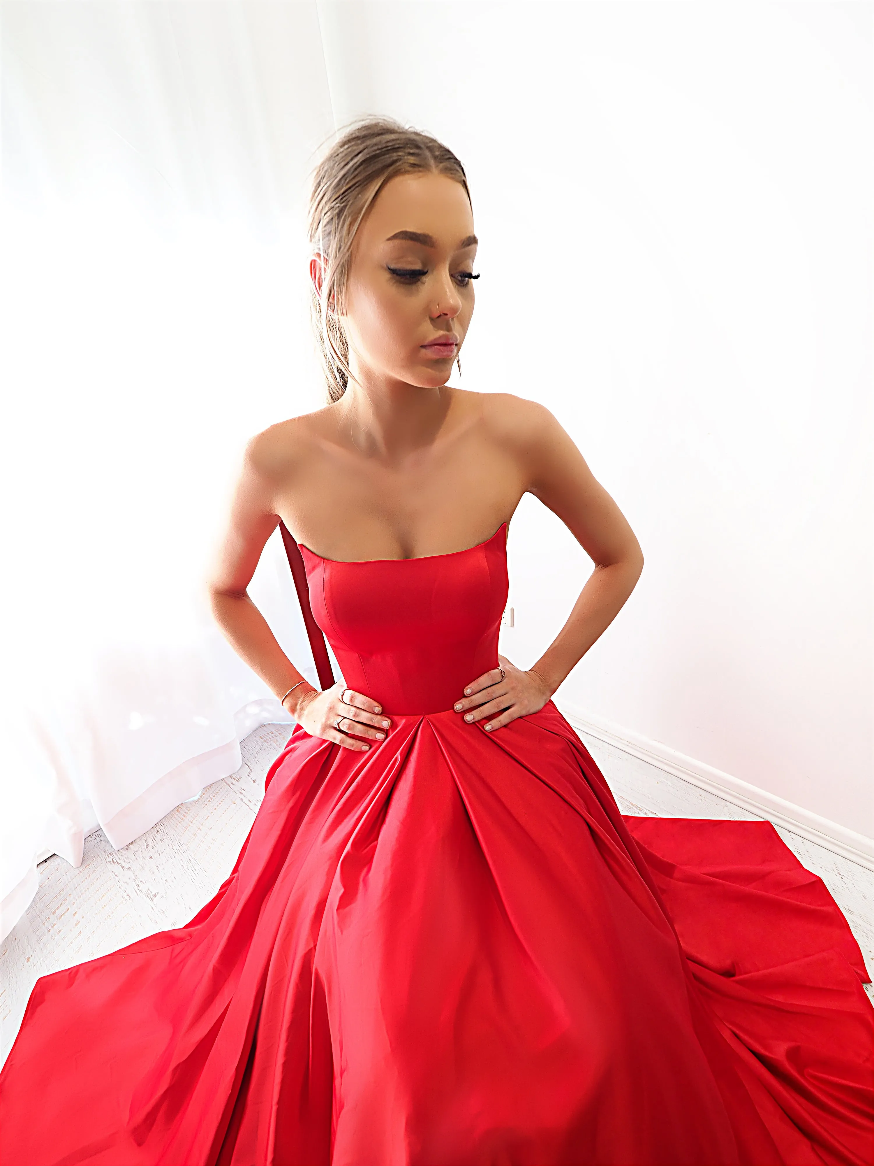 Bright red satin princess dress with crescent moon neckline